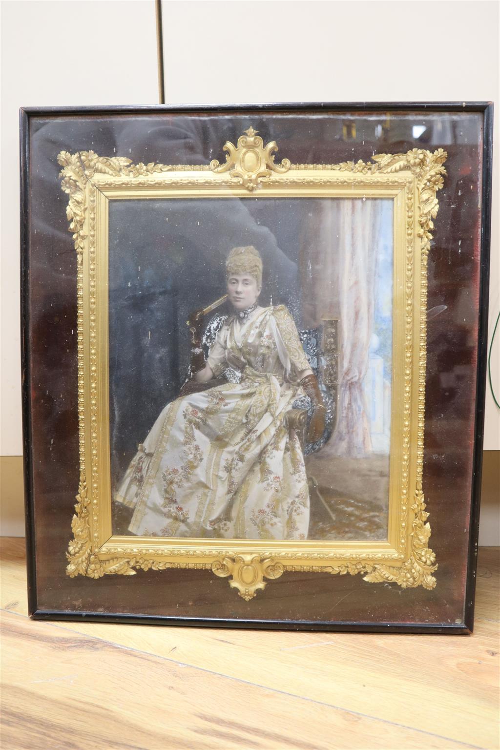 An Edwardian hand tinted photographic portrait of a seated lady, in ornate frame, image 29 x 24cm